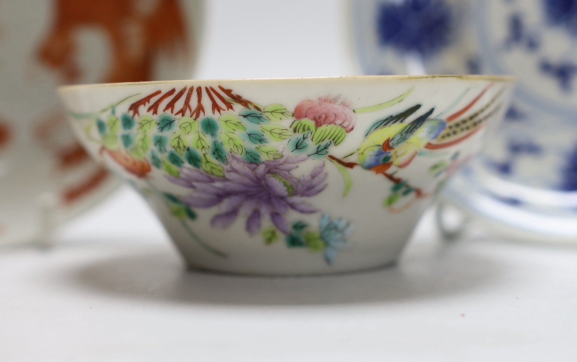 A Chinese blue and white saucer, together with a ‘dragon and phoenix’ saucer and a famille rose bowl